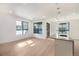 Open concept living room and kitchen with hardwood floors and lots of natural light at 2032 S Holly St # 3, Denver, CO 80222