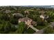 Aerial view of the property, showcasing its vast yard, basketball court, and surrounding neighborhood at 6122 Maroon Peak Pl, Castle Rock, CO 80108