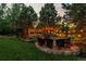 Cozy backyard fire pit area with comfortable seating and string lights, perfect for outdoor relaxation at 6122 Maroon Peak Pl, Castle Rock, CO 80108