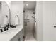 Stylish bathroom boasts sleek vanity, designer fixtures, and a modern glass enclosed shower at 6122 Maroon Peak Pl, Castle Rock, CO 80108