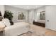 This bright bedroom features a built-in bench and large windows with unique views at 6122 Maroon Peak Pl, Castle Rock, CO 80108