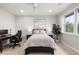 Cozy bedroom with neutral tones, comfortable bed, dark furniture, and bright window at 6122 Maroon Peak Pl, Castle Rock, CO 80108
