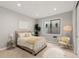 This simple bedroom features a plush rug, natural light, and minimal decor at 6122 Maroon Peak Pl, Castle Rock, CO 80108