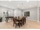 This dining room is equipped with a foosball table and large windows offering natural light at 6122 Maroon Peak Pl, Castle Rock, CO 80108