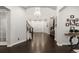Spacious foyer with gleaming hardwood floors, a chandelier, and staircase leading to the upper level at 6122 Maroon Peak Pl, Castle Rock, CO 80108