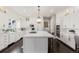 Spacious kitchen with white cabinets, stainless steel appliances, and a large island for cooking and entertaining at 6122 Maroon Peak Pl, Castle Rock, CO 80108