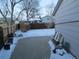Snowy backyard with storage shed and fenced perimeter at 2603 W 100Th Pl, Federal Heights, CO 80260