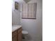 Small bathroom with updated vanity and toilet at 2603 W 100Th Pl, Federal Heights, CO 80260