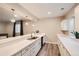 Basement wet bar with white cabinets and a modern sink at 5695 Cadara Way, Parker, CO 80134