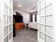 Bedroom with French doors and a large TV at 3200 Masters Pt, Castle Rock, CO 80104