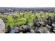 Aerial view showcasing the proximity to the golf course, surrounding neighborhood and the mature trees at 954 E Costilla Ave, Centennial, CO 80122