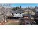 Aerial view of the home showcasing the deck, covered patio area, landscaping, and overall property layout at 954 E Costilla Ave, Centennial, CO 80122