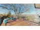 This large home's back deck has an excellent view of the landscape and surrounding trees and foliage at 954 E Costilla Ave, Centennial, CO 80122