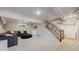 Spacious basement boasts plush carpeting, a comfortable seating area, and ample room for recreation at 954 E Costilla Ave, Centennial, CO 80122