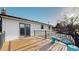 Large wooden deck with metal railings, perfect for outdoor seating and entertaining at 954 E Costilla Ave, Centennial, CO 80122