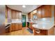 Charming kitchen with wooden cabinets, bright countertops, and an inviting atmosphere at 954 E Costilla Ave, Centennial, CO 80122