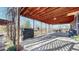 View of the covered space underneath the deck, featuring a grill and plenty of room to relax and enjoy the outdoors at 954 E Costilla Ave, Centennial, CO 80122