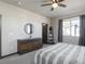 Cozy bedroom with a ceiling fan, neutral color scheme, and lots of natural light at 11659 W 44Th Ave, Wheat Ridge, CO 80033