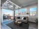 Inviting living room with a view of the outdoor patio, featuring comfortable seating and natural light at 11659 W 44Th Ave, Wheat Ridge, CO 80033