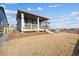 Home exterior showcasing a deck and grassy backyard at 270 Maddox Ln, Erie, CO 80516