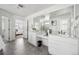 Bright primary bathroom featuring double vanity, generous counter space, and modern fixtures at 270 Maddox Ln, Erie, CO 80516