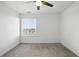 Bright bedroom featuring a ceiling fan and large window, providing ample natural light at 270 Maddox Ln, Erie, CO 80516