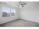 Bright bedroom featuring a ceiling fan and two large windows, providing ample natural light at 270 Maddox Ln, Erie, CO 80516