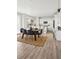 Kitchen and dining area with wooden table and white cabinets at 270 Maddox Ln, Erie, CO 80516