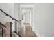 Modern entryway with hardwood floors and staircase at 270 Maddox Ln, Erie, CO 80516