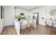 Modern white kitchen with stainless steel appliances and island at 270 Maddox Ln, Erie, CO 80516