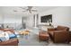 Cozy living room featuring stylish seating, a unique coffee table, and a view of the upper level landing at 270 Maddox Ln, Erie, CO 80516