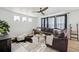 Bright living room featuring stylish decor, a comfortable sofa, and a ceiling fan at 270 Maddox Ln, Erie, CO 80516