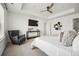 Spacious main bedroom with a large bed, modern furniture, and ample natural light, creating a luxurious retreat at 270 Maddox Ln, Erie, CO 80516