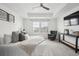 Serene main bedroom with a plush bed, tray ceiling, and a relaxing seating area, ideal for unwinding at 270 Maddox Ln, Erie, CO 80516