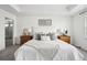 Elegant main bedroom with a comfortable bed, tray ceiling, and stylish nightstands, offering a peaceful retreat at 270 Maddox Ln, Erie, CO 80516