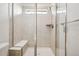 Luxurious glass shower with bronze fixtures, tiled walls, and a built-in bench at 270 Maddox Ln, Erie, CO 80516
