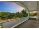 View from a covered balcony overlooking trees and mountains, perfect for enjoying the outdoors at 831 Crescent Dr, Boulder, CO 80303