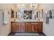 Bathroom featuring a double vanity, decorative towels and mirrors, with modern fixtures at 831 Crescent Dr, Boulder, CO 80303