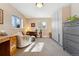 Comfortable bedroom with built-in wardrobe, desk, and a chair near a sunny window at 831 Crescent Dr, Boulder, CO 80303