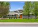 Two story home with lush lawn, mature trees, and mountain views at 831 Crescent Dr, Boulder, CO 80303