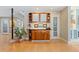 Well-lit hallway with custom cabinetry, hardwood floors, and modern decor at 831 Crescent Dr, Boulder, CO 80303