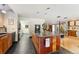 Modern kitchen with a center island, black appliances, and tiled floors at 831 Crescent Dr, Boulder, CO 80303