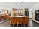 Kitchen featuring island seating, modern appliances, and open access to the dining area at 831 Crescent Dr, Boulder, CO 80303