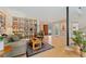 Cozy living room with built-in shelving, comfortable seating, and hardwood floors at 831 Crescent Dr, Boulder, CO 80303