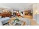 Bright, open-concept living area with hardwood floors, dining area and modern furnishings at 831 Crescent Dr, Boulder, CO 80303