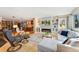 Spacious living room featuring a fireplace, built-in shelving, and an open floor plan at 831 Crescent Dr, Boulder, CO 80303
