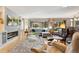 Inviting living room with a fireplace, large windows, and hardwood floors at 831 Crescent Dr, Boulder, CO 80303