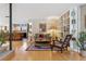 Inviting living room featuring an open layout, hardwood floors, and custom bookshelves at 831 Crescent Dr, Boulder, CO 80303