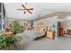 A spacious main bedroom with large windows, ceiling fan, and neutral tones throughout at 831 Crescent Dr, Boulder, CO 80303