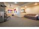 Finished basement featuring a gym and seating area with large windows at 13589 Callae Ct, Conifer, CO 80433